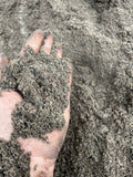 Nærbillede af planplæne topdressing i bigbag
